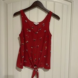 Pink rose, small, red tank top, with flower detail.